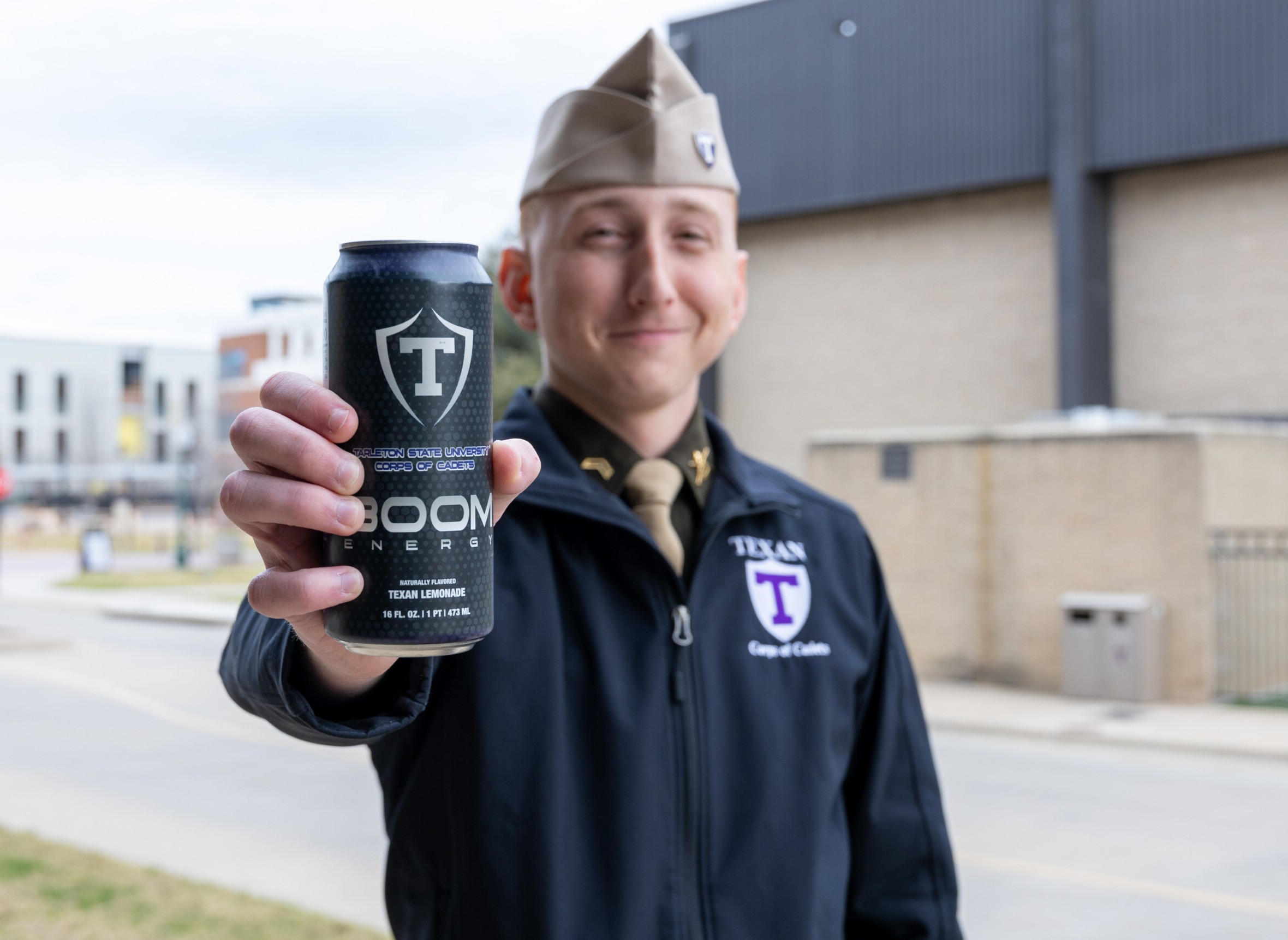 Cadet holding Boom energy drink
