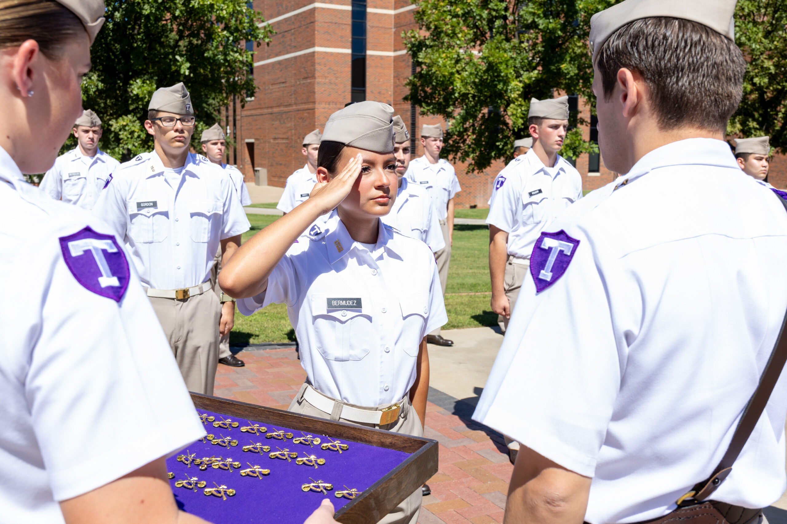 Cadet receiving Corps brass